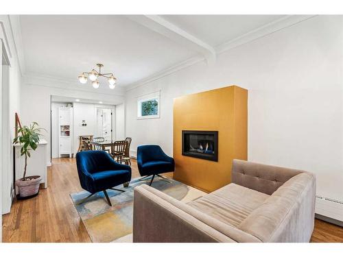 728 1 Avenue Nw, Calgary, AB - Indoor Photo Showing Living Room With Fireplace