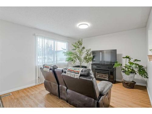 928 Pinecliff Drive Ne, Calgary, AB - Indoor Photo Showing Living Room With Fireplace