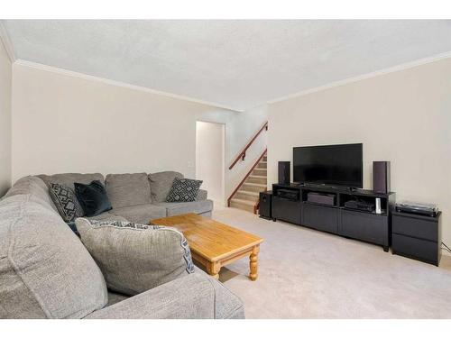 53 Shawinigan Road Sw, Calgary, AB - Indoor Photo Showing Living Room