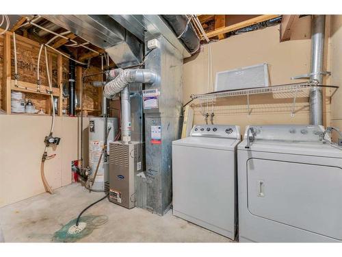 211 Cranberry Way Se, Calgary, AB - Indoor Photo Showing Laundry Room