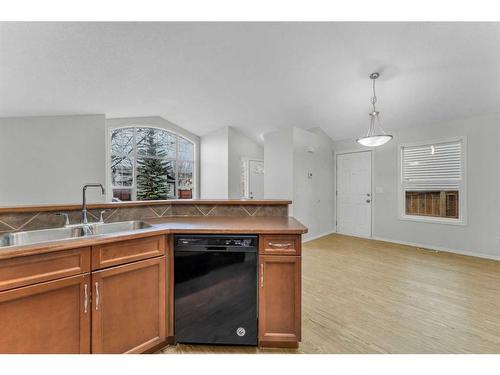 211 Cranberry Way Se, Calgary, AB - Indoor Photo Showing Kitchen With Double Sink