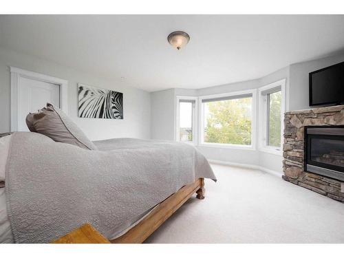 192 Lindstrom Crescent, Fort Mcmurray, AB - Indoor Photo Showing Bedroom With Fireplace