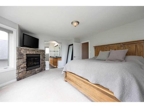 192 Lindstrom Crescent, Fort Mcmurray, AB - Indoor Photo Showing Bedroom With Fireplace