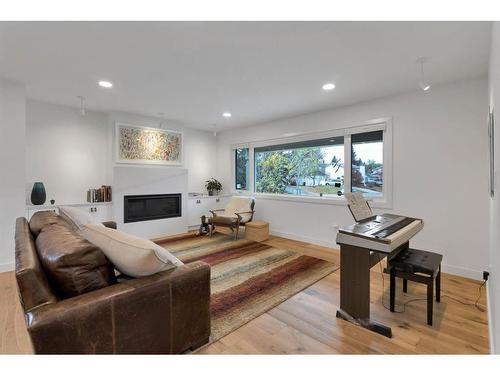 2316 Palisade Drive Sw, Calgary, AB - Indoor Photo Showing Living Room With Fireplace