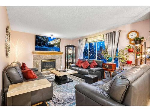 9838 Hidden Valley Drive Nw, Calgary, AB - Indoor Photo Showing Living Room With Fireplace