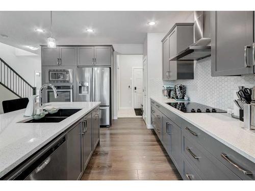 27 Bayview Circle Sw, Airdrie, AB - Indoor Photo Showing Kitchen With Stainless Steel Kitchen With Double Sink With Upgraded Kitchen