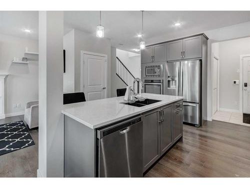 27 Bayview Circle Sw, Airdrie, AB - Indoor Photo Showing Kitchen With Stainless Steel Kitchen With Double Sink With Upgraded Kitchen