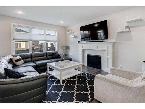 27 Bayview Circle Sw, Airdrie, AB - Indoor Photo Showing Living Room With Fireplace