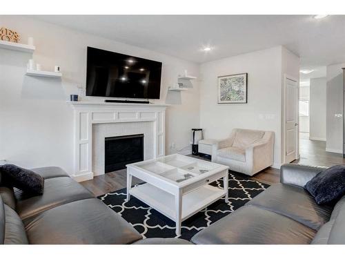 27 Bayview Circle Sw, Airdrie, AB - Indoor Photo Showing Living Room With Fireplace