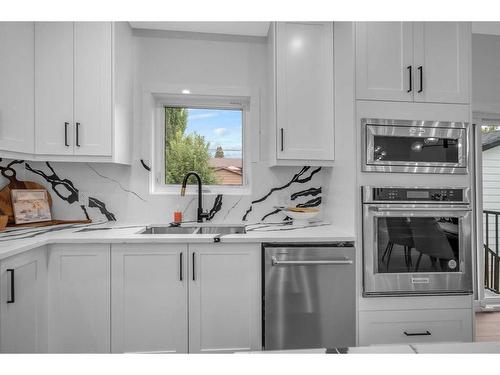 1172 Lake Sundance Crescent Se, Calgary, AB - Indoor Photo Showing Kitchen With Double Sink