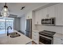 424-400 Auburn Meadows Common Se, Calgary, AB  - Indoor Photo Showing Kitchen With Double Sink 