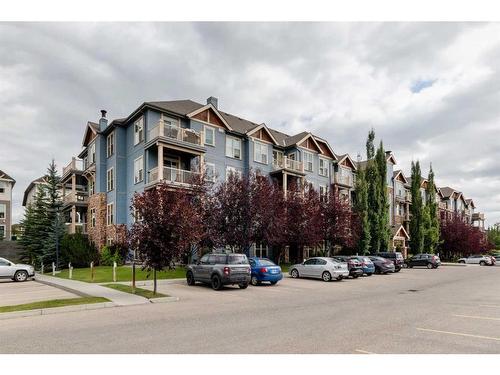 109-201 Sunset Drive, Cochrane, AB - Outdoor With Facade