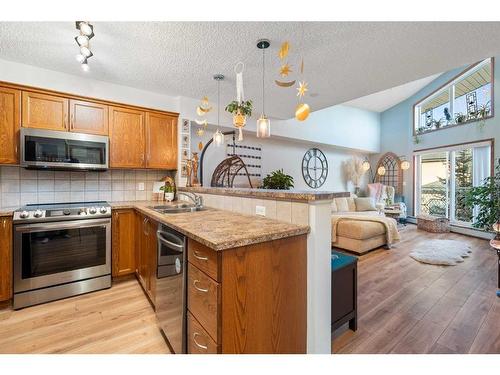 305-390 Marina Drive, Chestermere, AB - Indoor Photo Showing Kitchen With Double Sink