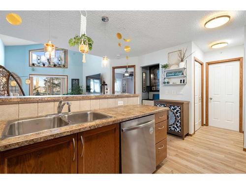 305-390 Marina Drive, Chestermere, AB - Indoor Photo Showing Kitchen With Double Sink