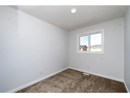 140 Langwell Common Se, Airdrie, AB - Indoor Photo Showing Other Room