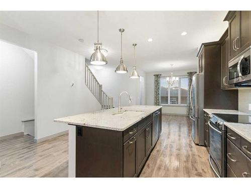 65 River Heights Drive, Cochrane, AB - Indoor Photo Showing Kitchen With Upgraded Kitchen