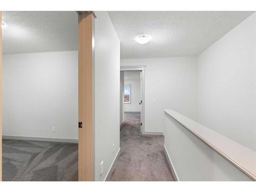 65 River Heights Drive, Cochrane, AB - Indoor Photo Showing Other Room