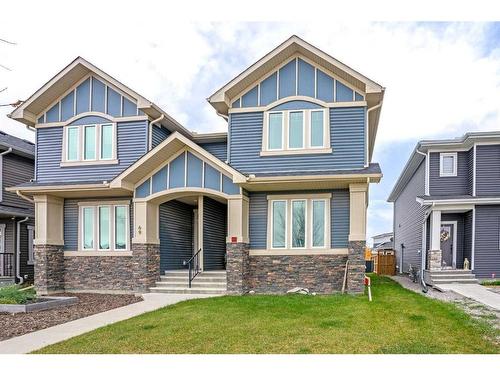 65 River Heights Drive, Cochrane, AB - Outdoor With Facade