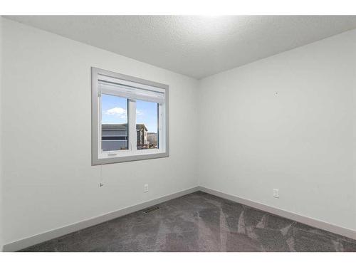 65 River Heights Drive, Cochrane, AB - Indoor Photo Showing Other Room