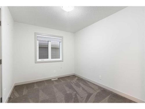 65 River Heights Drive, Cochrane, AB - Indoor Photo Showing Other Room