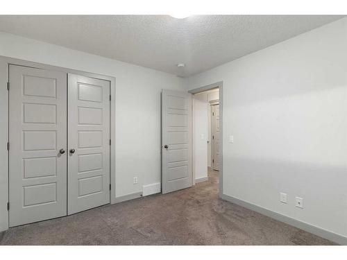 65 River Heights Drive, Cochrane, AB - Indoor Photo Showing Other Room