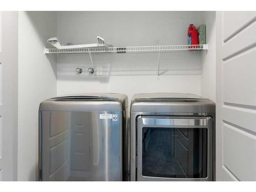 65 River Heights Drive, Cochrane, AB - Indoor Photo Showing Laundry Room