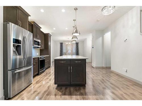 65 River Heights Drive, Cochrane, AB - Indoor Photo Showing Kitchen