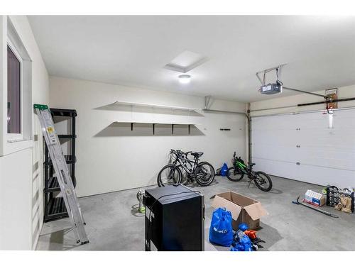 65 River Heights Drive, Cochrane, AB - Indoor Photo Showing Garage