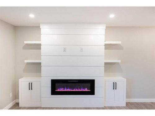 7447 Huntertown Crescent Nw, Calgary, AB - Indoor With Fireplace