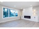 7447 Huntertown Crescent Nw, Calgary, AB  - Indoor Photo Showing Living Room With Fireplace 