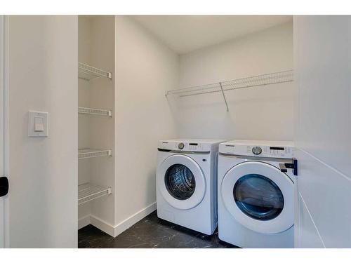 143 Mill Road, Cochrane, AB - Indoor Photo Showing Laundry Room