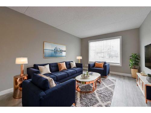 605-2200 Woodview Drive Sw, Calgary, AB - Indoor Photo Showing Living Room