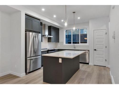 147 South Shore Court, Chestermere, AB - Indoor Photo Showing Kitchen With Stainless Steel Kitchen With Upgraded Kitchen