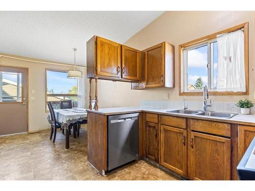 327 Shawbrooke Circle Sw, Calgary, AB - Indoor Photo Showing Kitchen With Double Sink