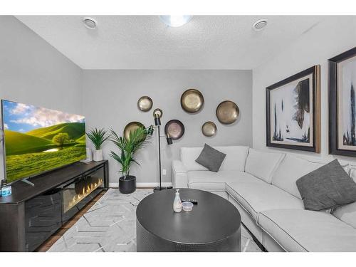 133 Corner Meadows Way Ne, Calgary, AB - Indoor With Fireplace