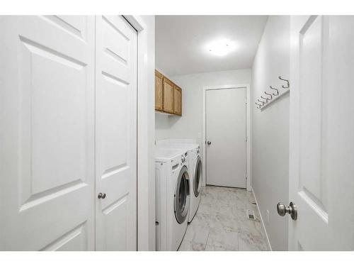 56 Arbour Cliff Court Nw, Calgary, AB - Indoor Photo Showing Laundry Room