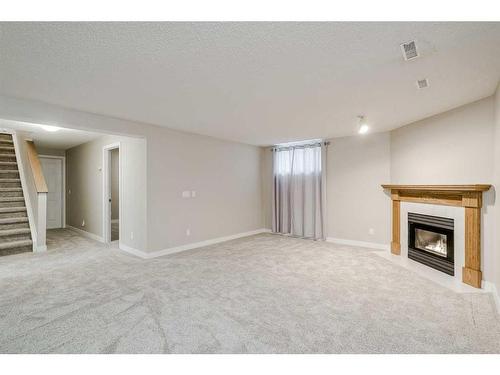 56 Arbour Cliff Court Nw, Calgary, AB - Indoor With Fireplace