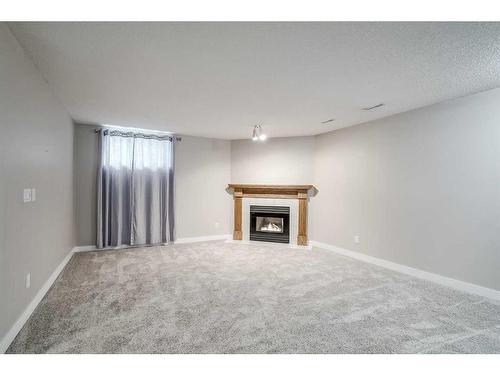 56 Arbour Cliff Court Nw, Calgary, AB - Indoor With Fireplace