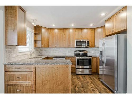 56 Arbour Cliff Court Nw, Calgary, AB - Indoor Photo Showing Kitchen With Stainless Steel Kitchen