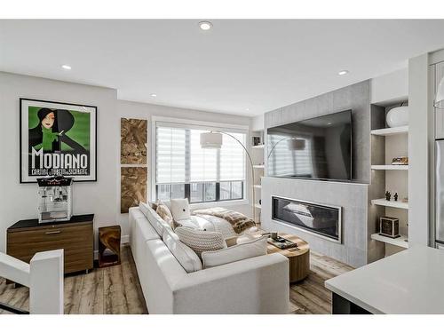 24-130 Discovery Drive Sw, Calgary, AB - Indoor Photo Showing Living Room With Fireplace