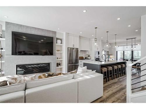 24-130 Discovery Drive Sw, Calgary, AB - Indoor Photo Showing Living Room With Fireplace