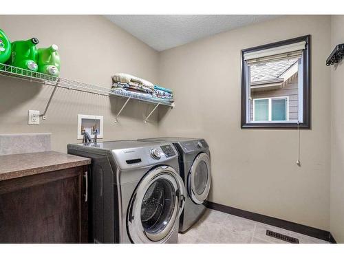 5 Masters Park Se, Calgary, AB - Indoor Photo Showing Laundry Room