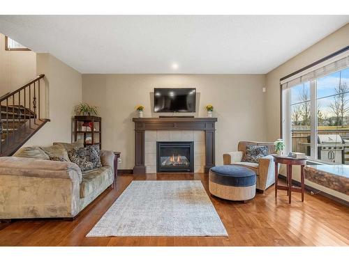 5 Masters Park Se, Calgary, AB - Indoor Photo Showing Living Room With Fireplace