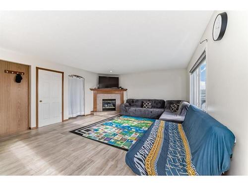 25 Taracove Way Ne, Calgary, AB - Indoor With Fireplace