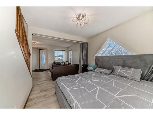 25 Taracove Way Ne, Calgary, AB - Indoor Photo Showing Bedroom