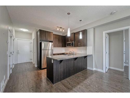 304-8 Sage Hill Terrace Nw, Calgary, AB - Indoor Photo Showing Kitchen With Stainless Steel Kitchen With Upgraded Kitchen