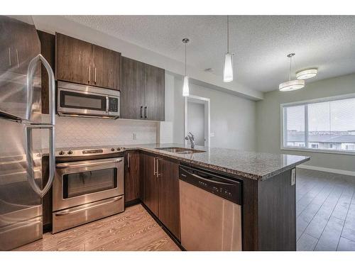 304-8 Sage Hill Terrace Nw, Calgary, AB - Indoor Photo Showing Kitchen With Stainless Steel Kitchen