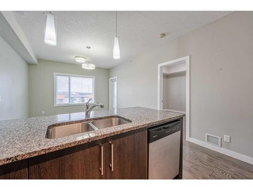 304-8 Sage Hill Terrace Nw, Calgary, AB - Indoor Photo Showing Kitchen With Double Sink