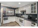 66 Everglade Drive Se, Airdrie, AB  - Indoor Photo Showing Kitchen With Double Sink 