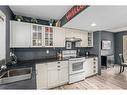 66 Everglade Drive Se, Airdrie, AB  - Indoor Photo Showing Kitchen With Double Sink 